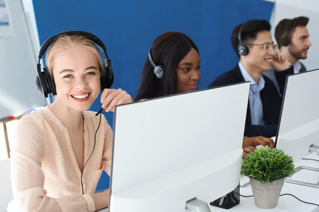 joyful-customer-service-agents-with-headphones-communicating-with-clients-at-call-center.jpg